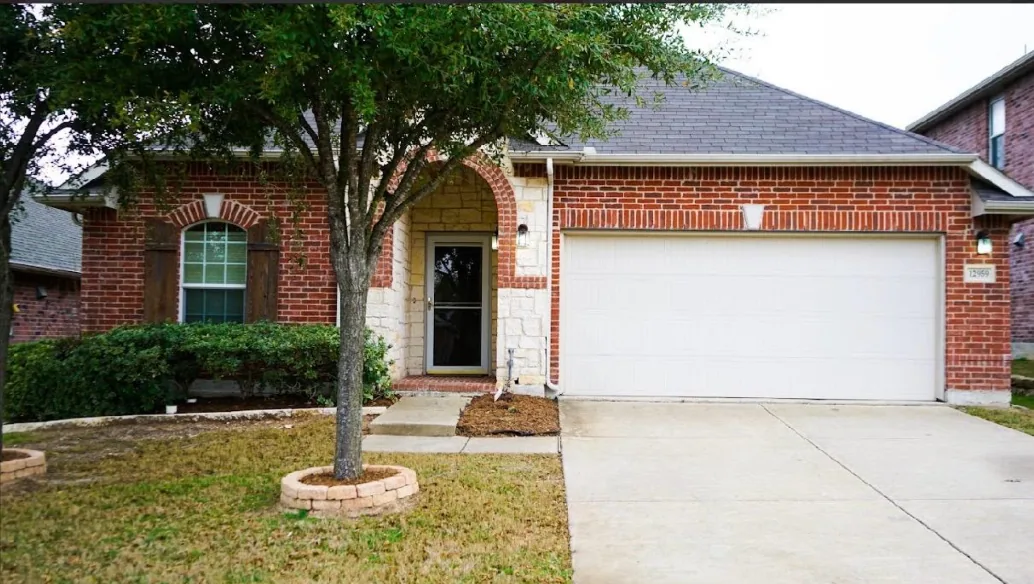 The Heritage Touch Senior Care home — a brick house on a quiet residential street in Frisco, Texas