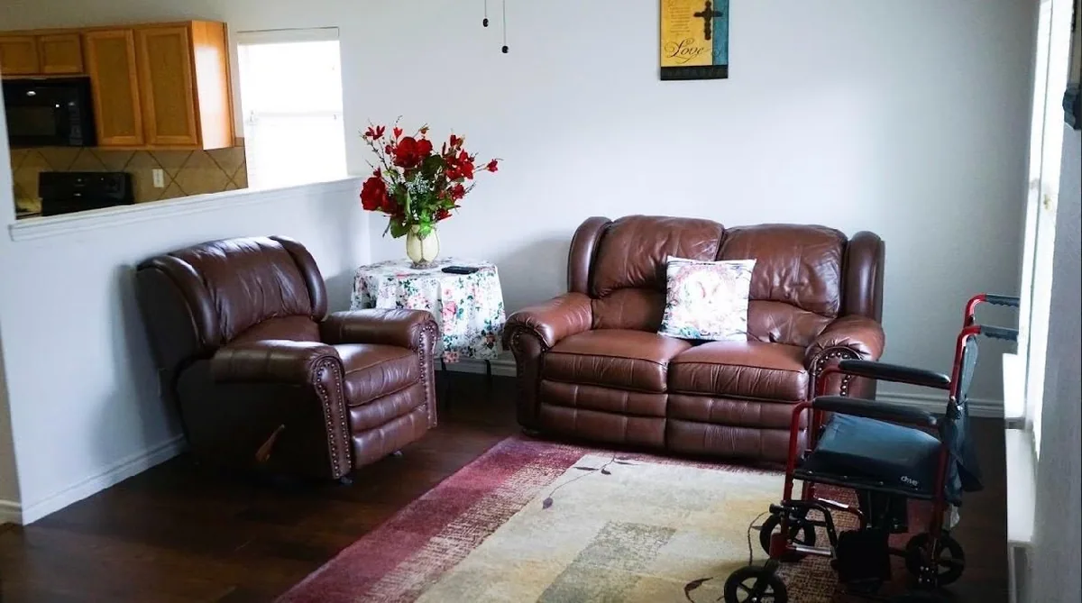 One of the living areas at Heritage Touch, with leather recliners and sofas arranged for conversation